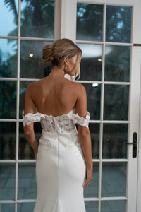 Back image of White Off The Shoulder Wedding Gown with Semi Sheer Corset Style Bodice, Sweetheart Off Shoulder Neckline with hand sewn Lace Appliques