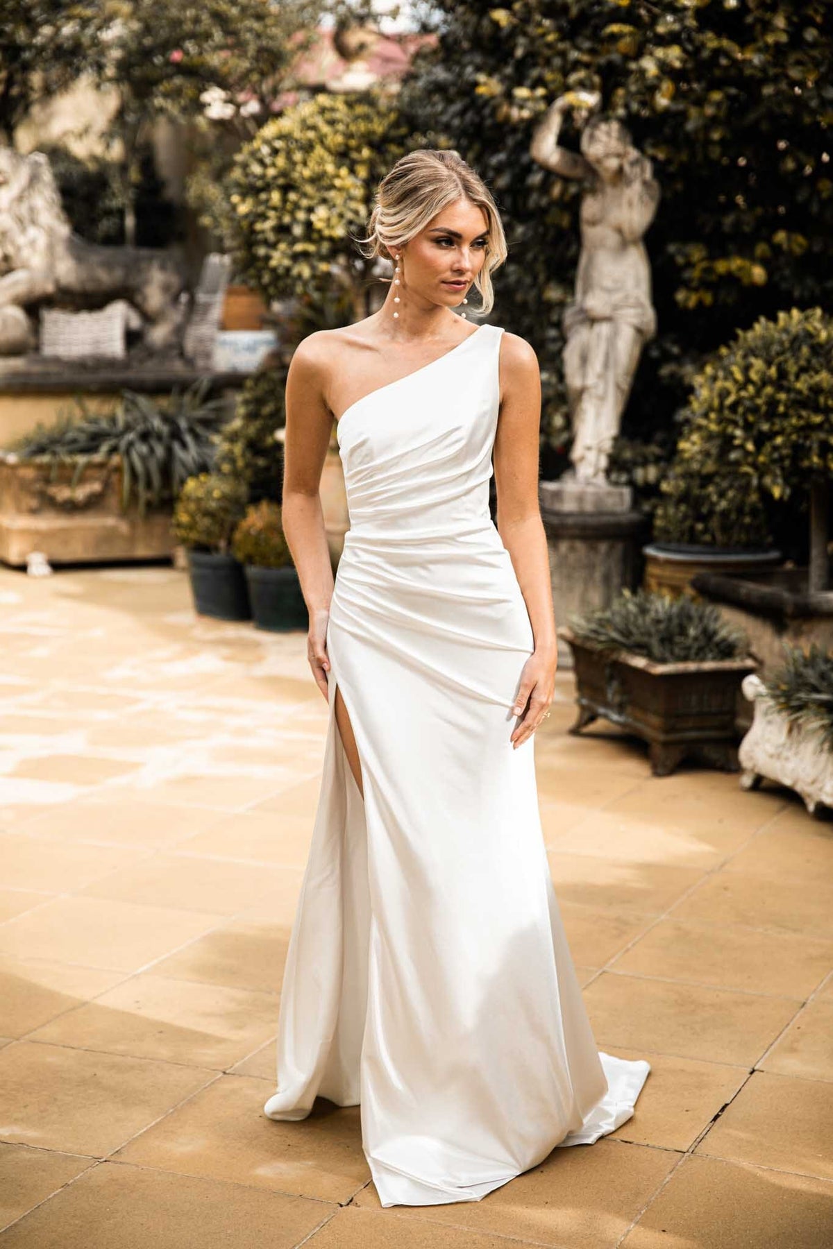 Ivory White High Shine Stretch Satin One Shoulder Long Evening Gown with Gathered Waist Detail and Side Slit