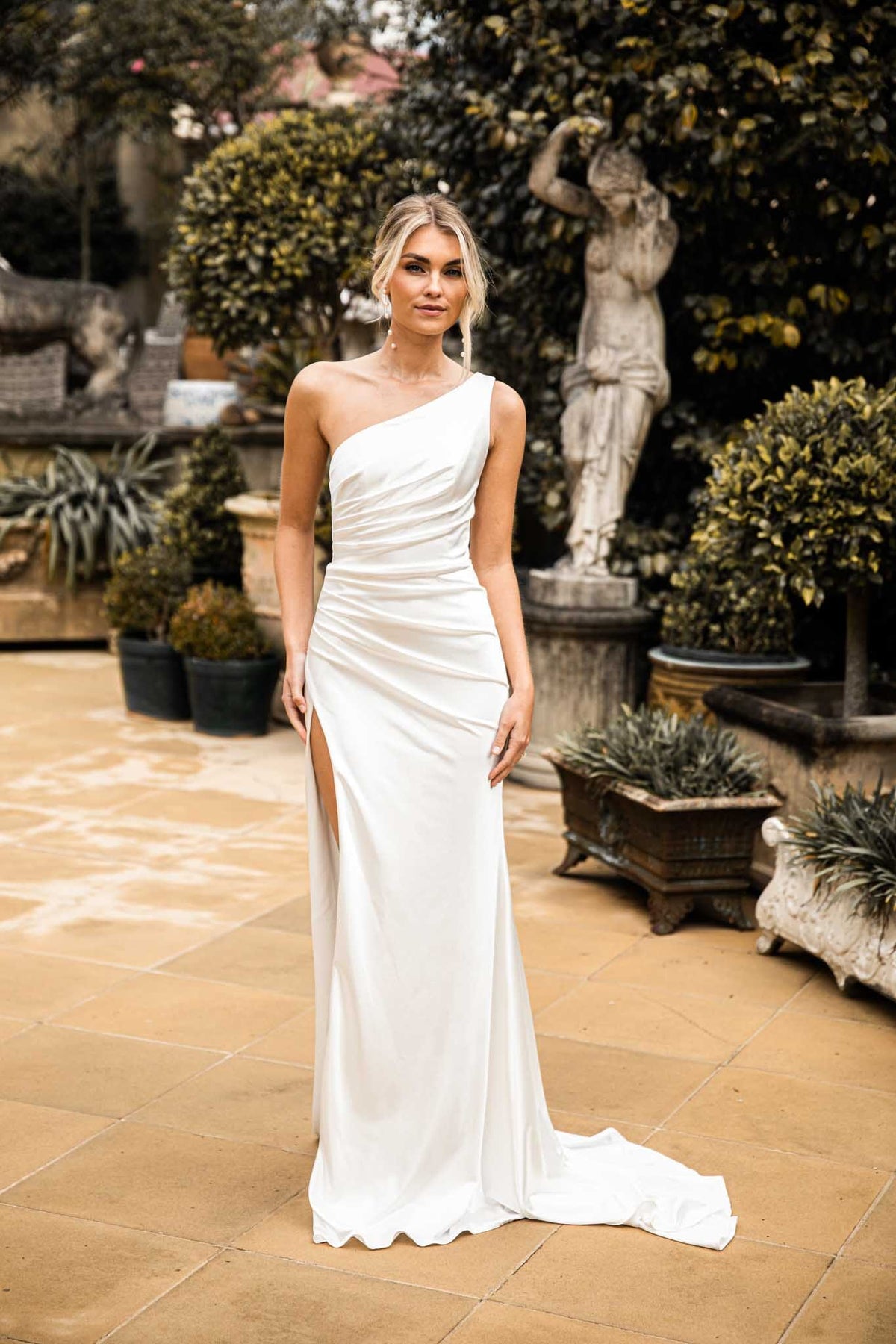 Ivory White High Shine Stretch Satin One Shoulder Long Evening Gown with Gathered Waist Detail and Side Slit