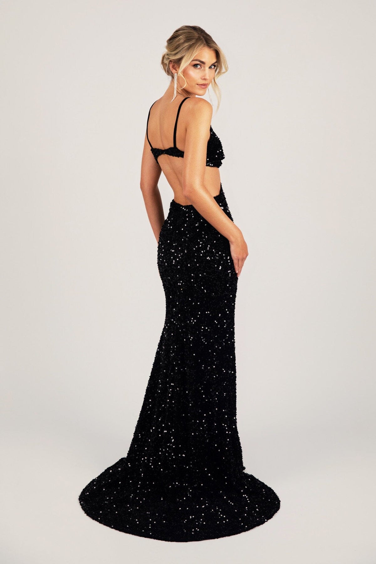 Side Image of Black Velvet Sequin Fitted Evening Long Gown with Thin Shoulder Straps, Side Cut Outs and Mermaid Full Length Skirt