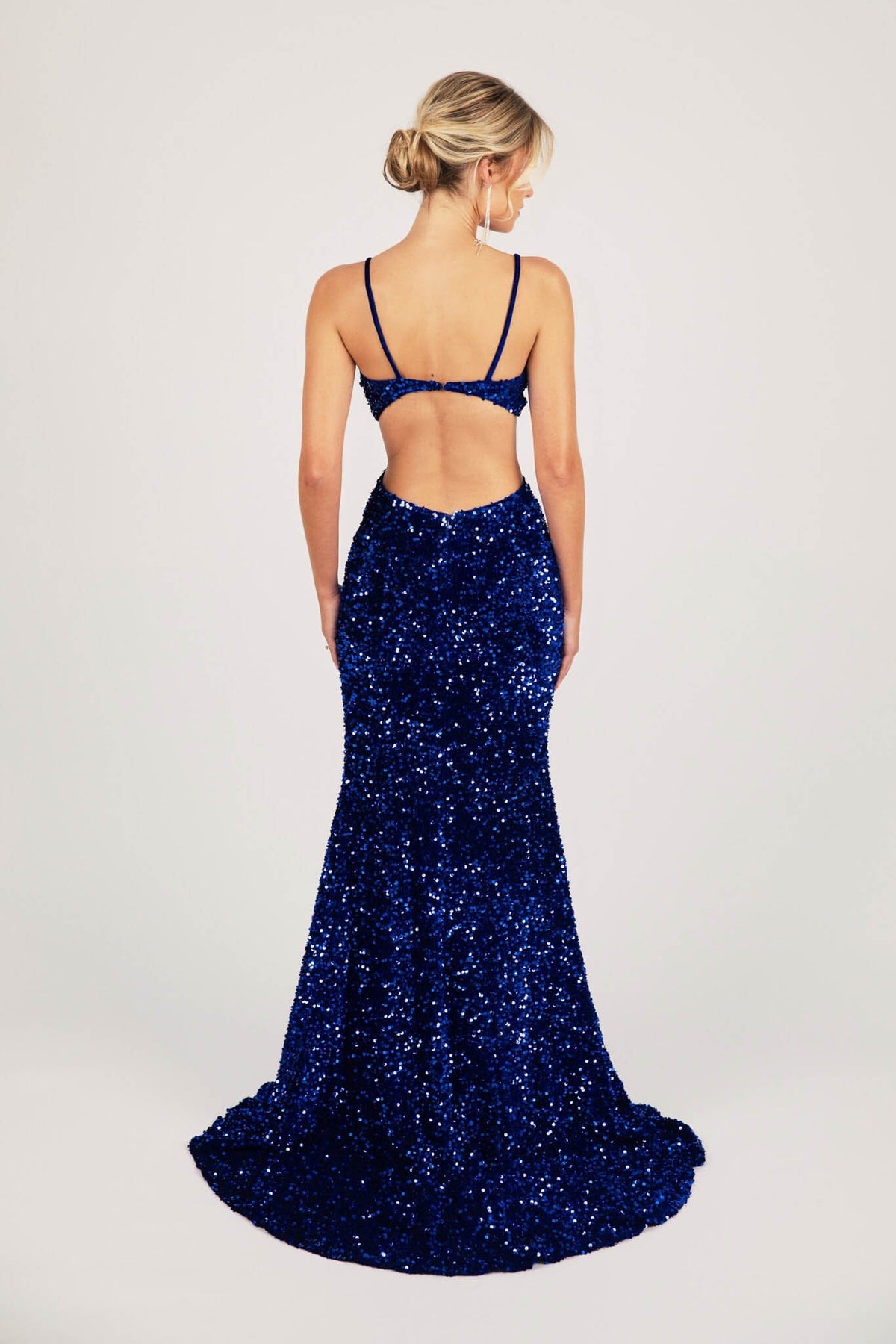 Open Back Design of Royal Blue Velvet Sequin Fitted Evening Long Gown with Thin Shoulder Straps, Side Cut Outs and Mermaid Full Length Skirt