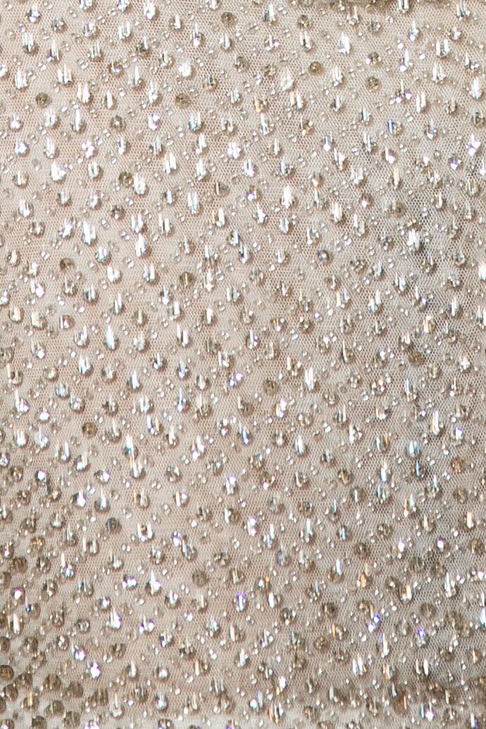 Close up image of sparkly rhinestone embellished on power mesh