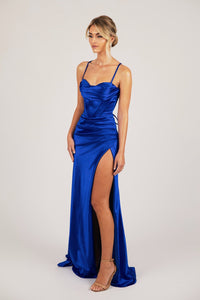 Side Leg Slit of Royal Blue Evening Gown with Corset Bodice, Draped Detail over Sweetheart Neckline, Thin Shoulder Straps and Lace Up Back