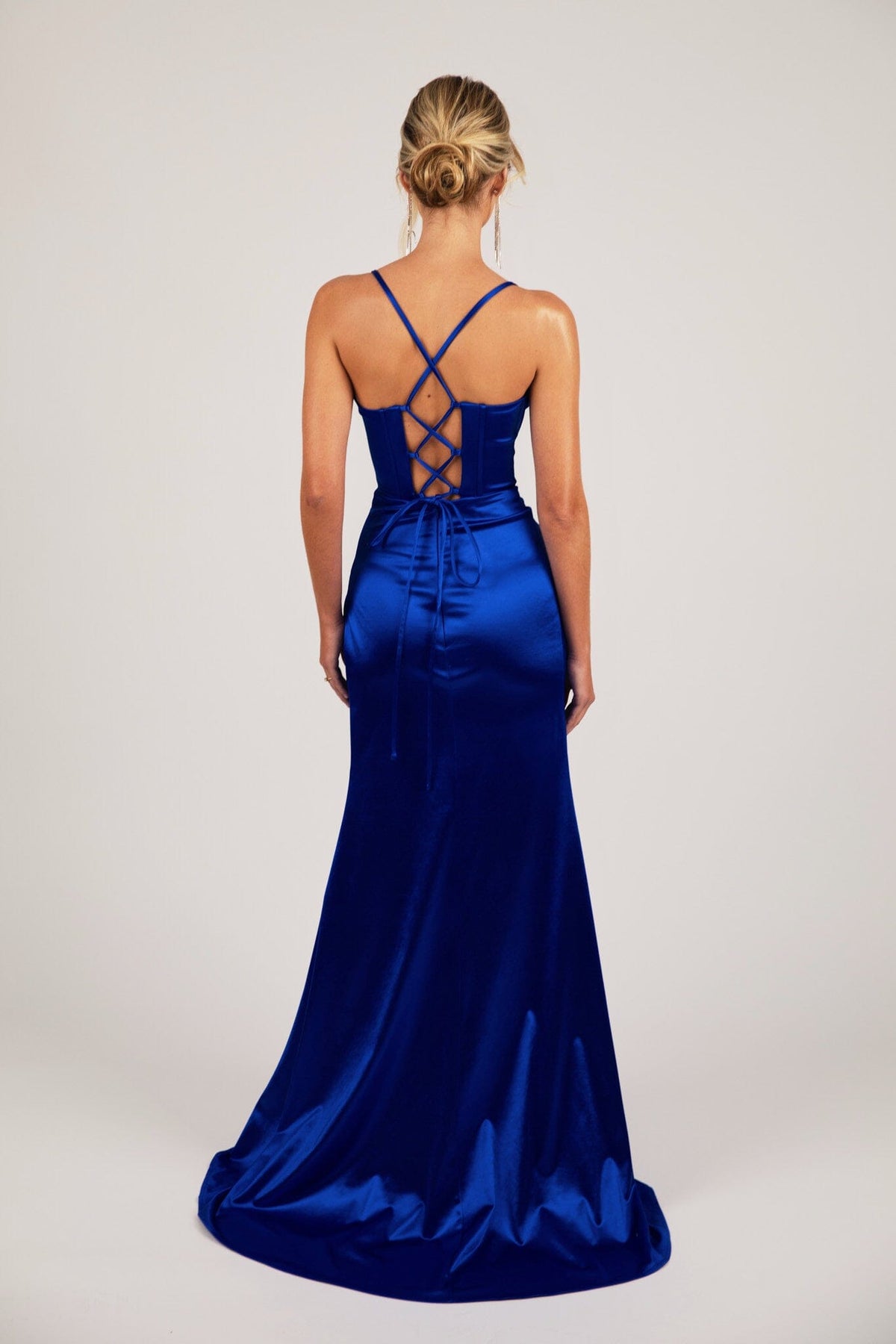 Lace Up Back Design of Royal Blue Evening Gown with Corset Bodice, Draped Detail over Sweetheart Neckline, Thin Shoulder Straps, and High Side Split